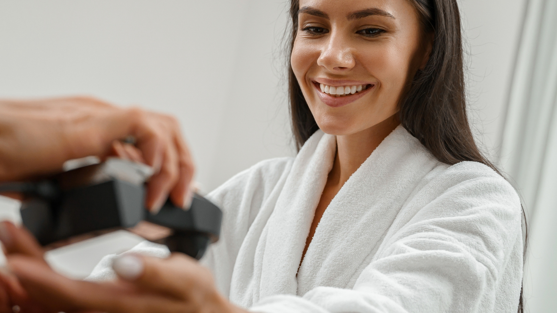 Woman in robe getting one of the most common medical procedures.