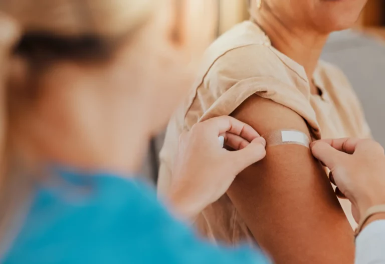 Direct Primary Care: Providing personalized and accessible healthcare. Closeup of putting a bandaid on the arm for overall well-being.